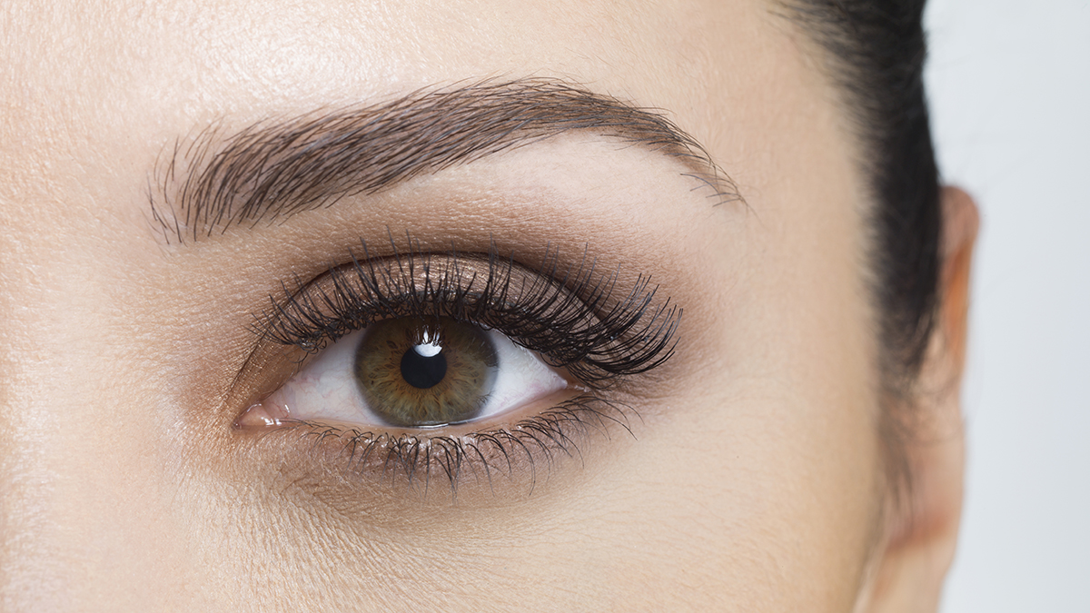 A woman with a perfectly formed eyebrow to illustrate brow lamination before and after