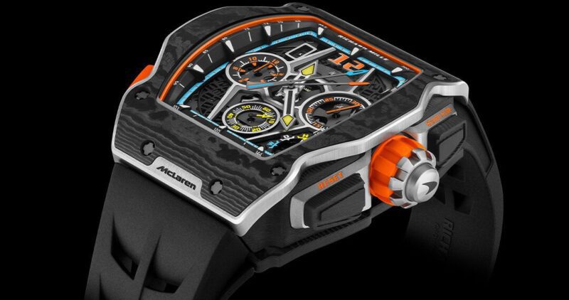 Un reloj de lujo íntimo con un diseño blanco, con una llamativa combinación de colores negro y naranja, esferas multifacéticas y gruesas correas negras que ofrecen un estilo de vida de lujo.