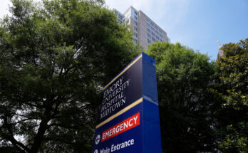 A photo of a sign outside of the Emory University Hospital emergency room.