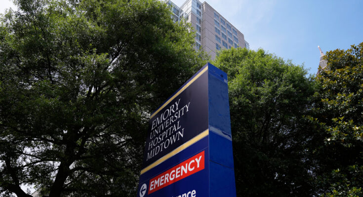 A photo of a sign outside of the Emory University Hospital emergency room.