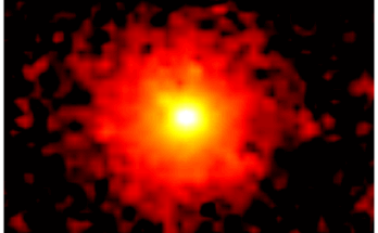 Against a black background is a red circle, which appears fuzzy and slightly pixelated. At the center is a bright area of yellow, and at the center of that is a bright area of white.