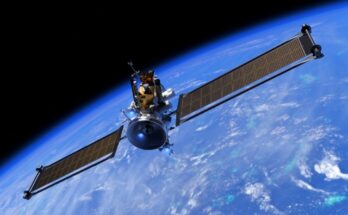 a cube-shaped spacecraft with two long wing-like solar panels in orbit above earth