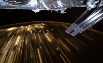 The warm city lights of Southeast Asia streak below the silvery U.S. segment of the International Space Station in this 30-second exposure from the orbital outpost as it soared 259 miles above China at approximately 10:39 a.m. local time. Near the top center, is the partially obscured SpaceX Dragon spacecraft that docked to the Harmony module's forward port carrying NASA's Crew-11 mission.