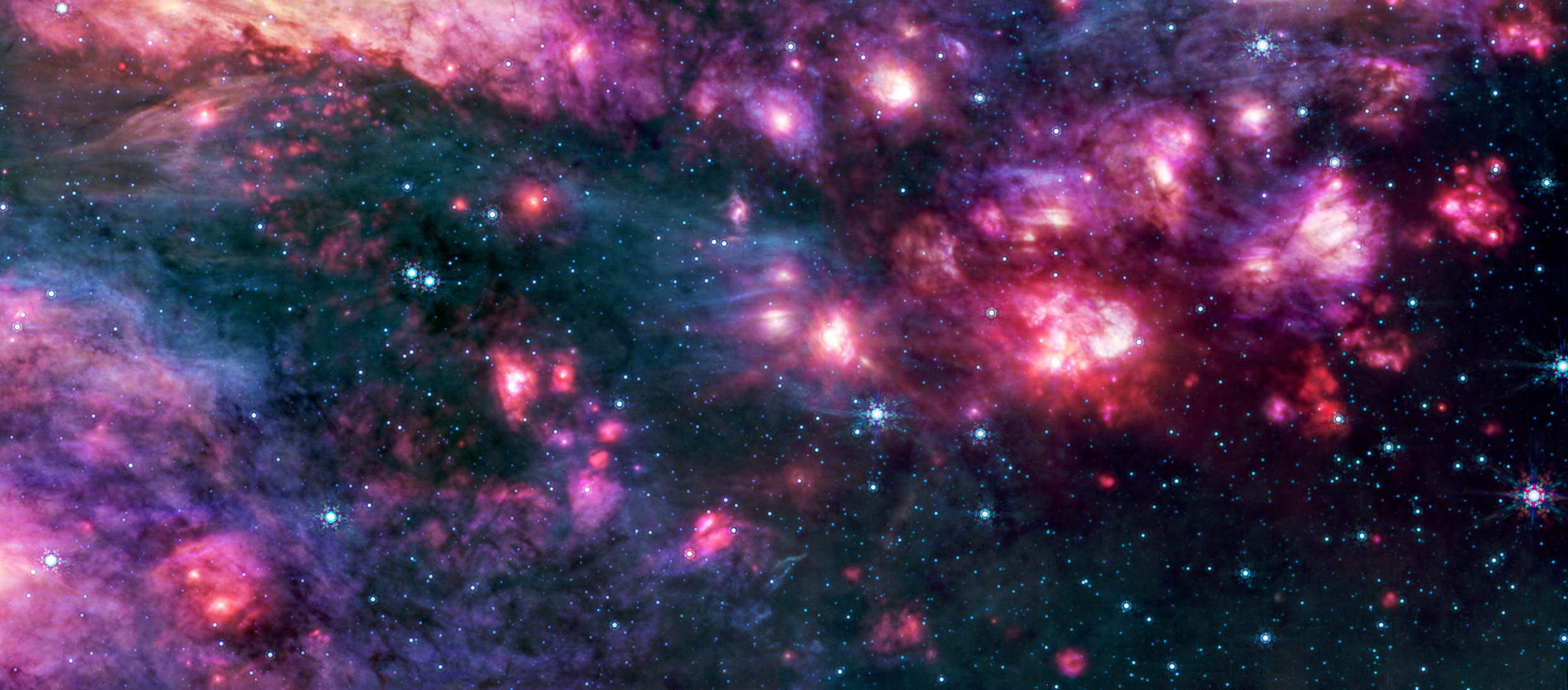 Cloader con círculos rosados ​​y morados con sitios brillantes, rodeado por un espacio oscuro con estrellas azules azules. Un grupo nublado débil al rojo derecho es más que otra área de imagen.