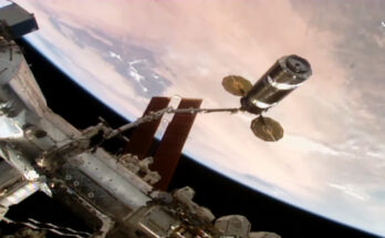 The Cygnus XL cargo craft is maneuvered by the Canadarm2 robotic arm toward the International Space Station's Unity module for installation.