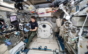 NASA astronaut Anne McClain performs the first series of tests of an Astrobee robot, Bumble, during a hardware checkout.