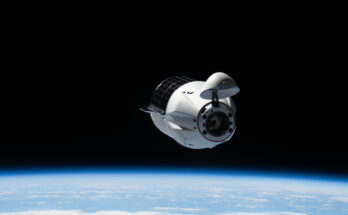 A SpaceX Dragon cargo spacecraft with its nosecone open and carrying over 5,000 pounds of science, supplies, and hardware for NASA's SpaceX CRS-33 mission approaches the International Space Station for an automated docking to the Harmony module's forward port. Both spacecraft were flying 262 miles above the Atlantic Ocean east of the Canadian province of Newfoundland at the time of this photograph.