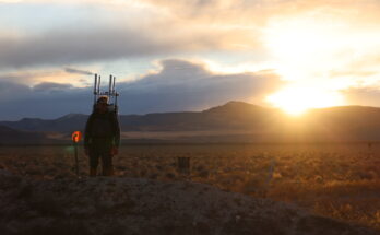 A person walks with a prototype backpack in the Nevada desert.