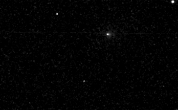a low-resolution animation of a comet passing through a dark starry sky