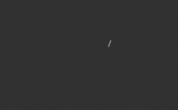 a streak of light on a black background