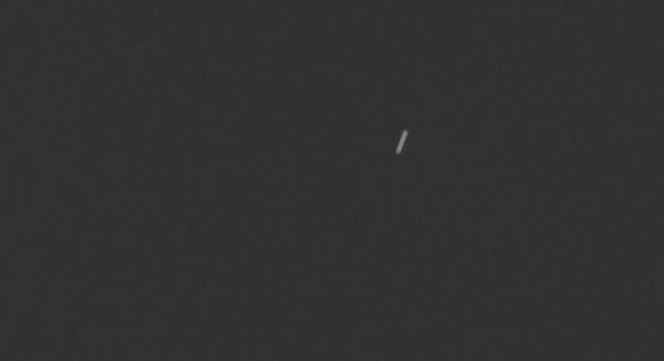 a streak of light on a black background