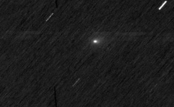 a bright white orb on a black, streaky background